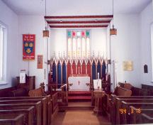 View of wide centre aisle to altar, reredos and sanctuary window –
1994; OHT, 1994