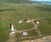 Aerial view of Cape Anguille Light Tower, showing its focal and dominant presence within the lightstation, 2000.; Department of Fisheries and Oceans / Ministères des Pêches et Océans, 2000.