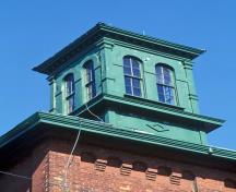 Detail view of Gooderham and Worts Distillery showing coordinated palette of material and paint colours throughout.; Parks Canada Agency / Agence Parcs Canada.