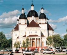 View of the main entrance to the Ukrainian Catholic Church of the Immaculate Conception, showing its multi-domed Kievan style.; Parks Canada Agency / Agence Parcs Canada.