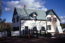 General view of Green Gables House, showing the wood frame construction clad in white painted shingles, 2002.; Parks Canada | Parcs Canada, J. Daniluck, 2002.