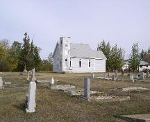 View of church and cemetery from the SW, 2003.; Government of Saskatchewan, Jennifer Bisson, 2003.