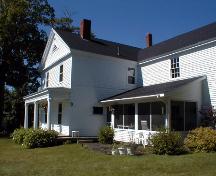 This side view of the house includes the verandah and the gabled end of the main part of the house.; PNB 2004