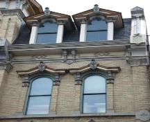 Featured are the decorative dormer windows and the cornice supported by brackets.; Martina Braunstein, 2007.